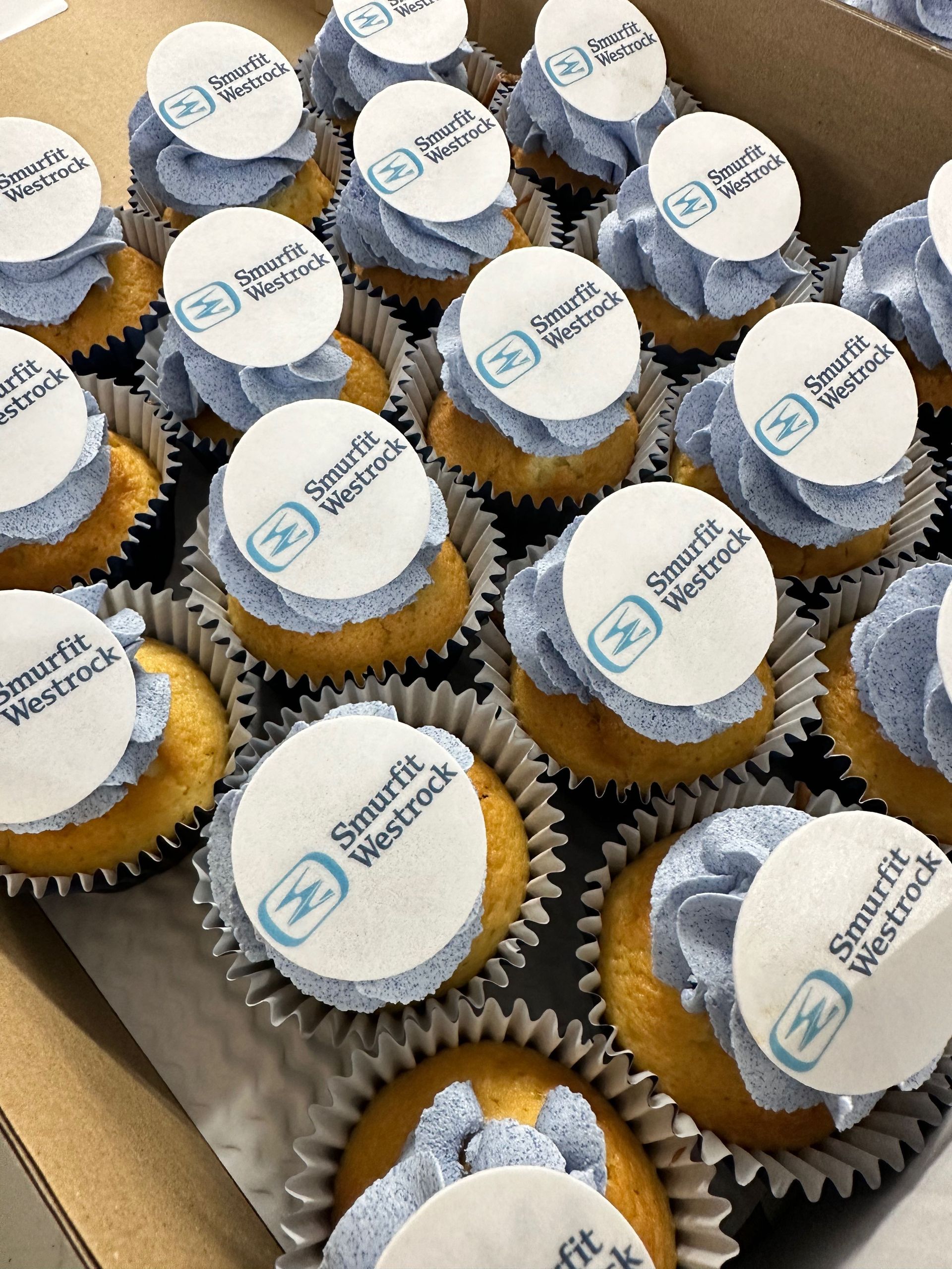 Corporate celebration cupcakes with themed toppers