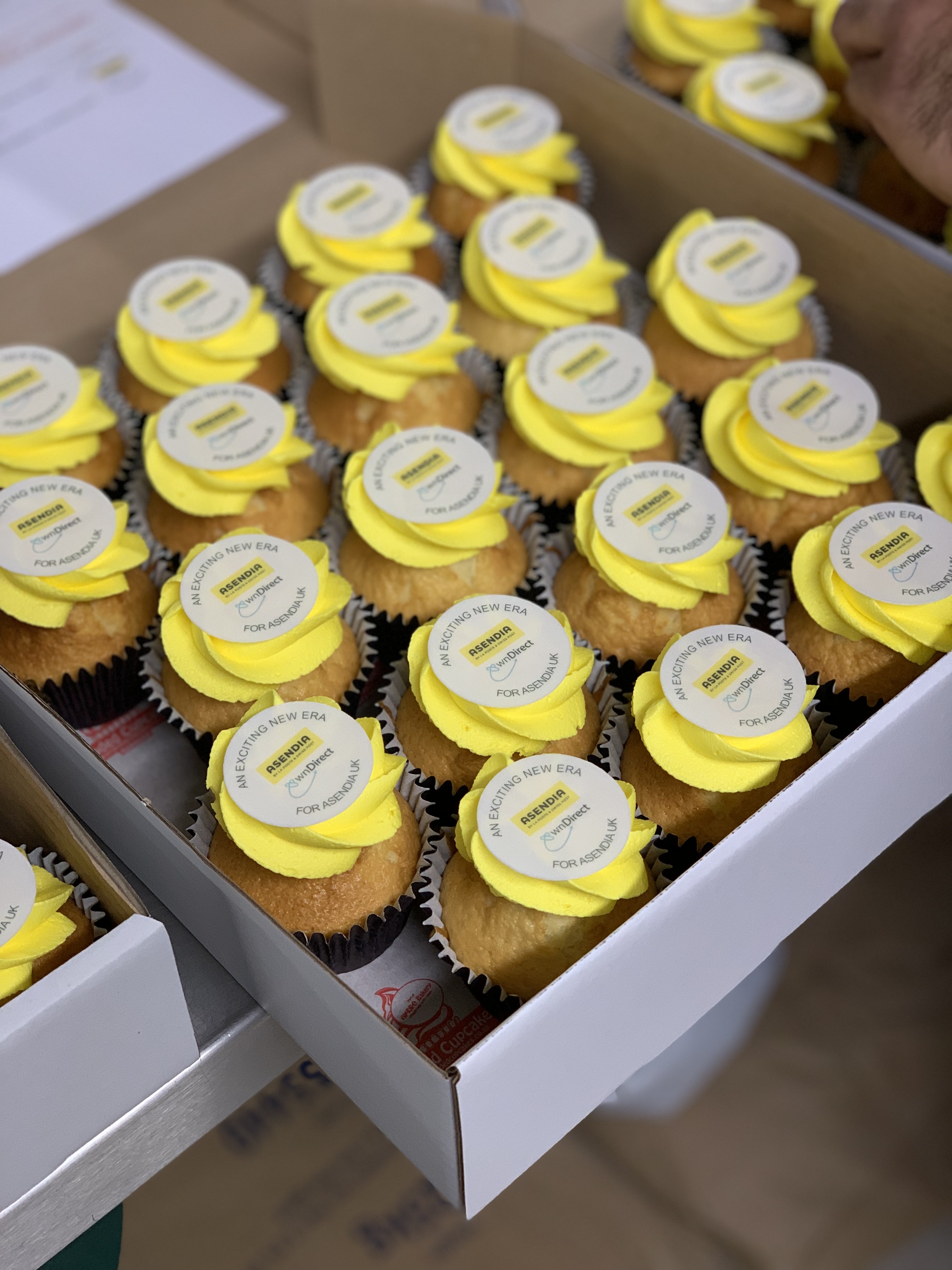 Hand-decorated branded cupcakes with artisan piping